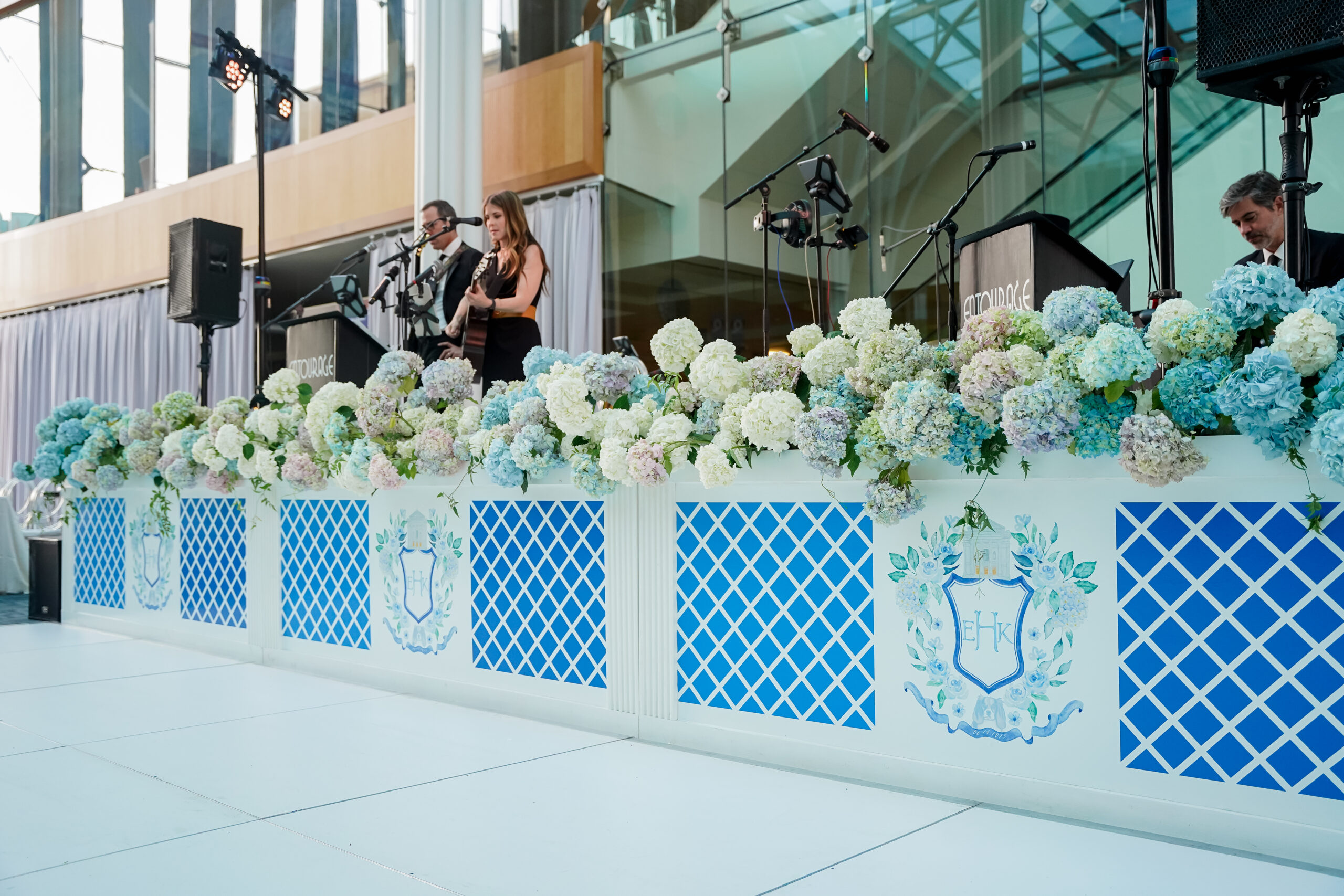 Band stage decorated with custom hydrangea flower wall