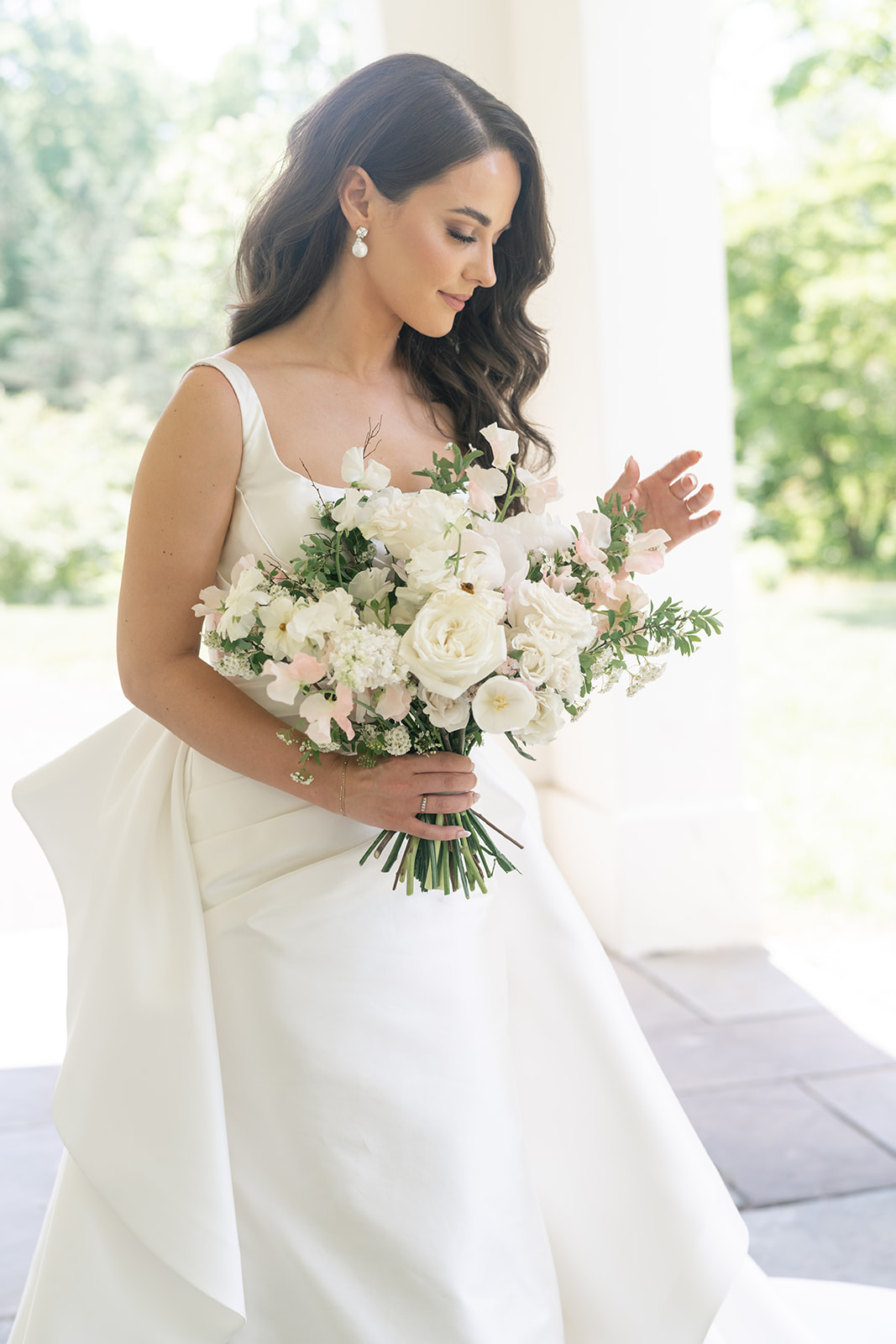 Bride admiring her bouquet